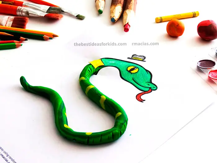 Art supplies and Snake from Complete The Animals Game - Fun idea for an Arts and Crafts game where kids exercise their creativity and problem-solving skills by coming up with different ways to complete the bodies of different animals. Free PDF has the base drawings for printable for the following animals: Lion, Bird, Cat, Turtle, Snake, Fish, Butterfly and Sheep.