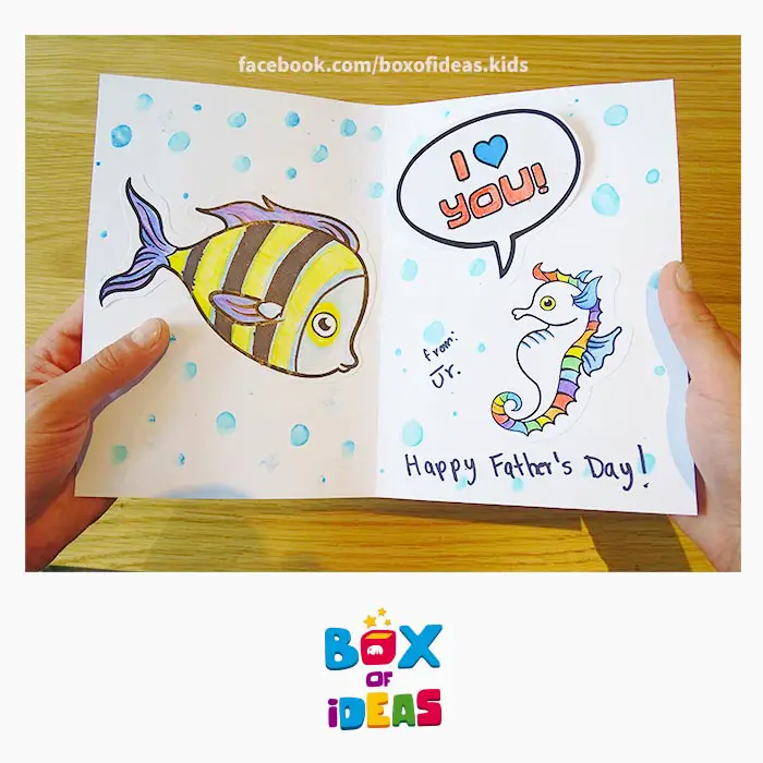 daddy-fish-and-seahorse-illustrated-guess-what-bilingual-card-for-Inclusive-Modern-DIY-Fathers-Day-Gift-by-box-of-ideas