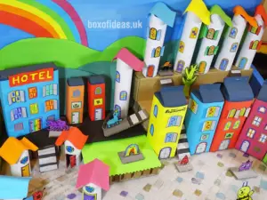 Colorful recycling craft buildings for a recycled town project. A fun DIY kids craft toy made out of recycling #recycling #kidscrafts #colorful