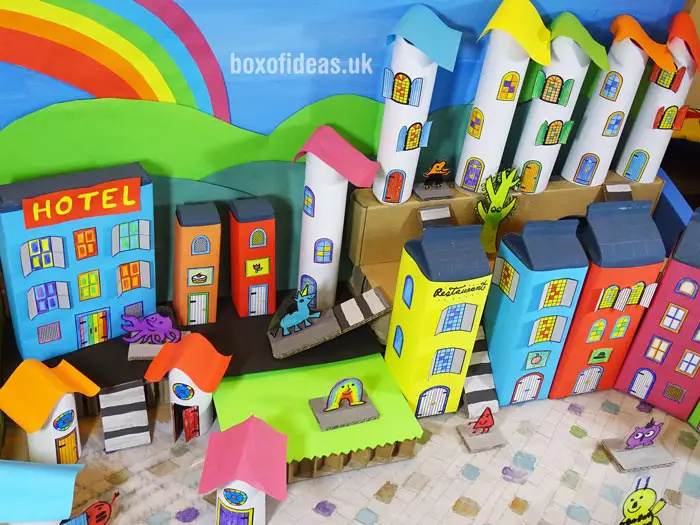 Colorful recycling craft buildings for a recycled town project. A fun DIY kids craft toy made out of recycling #recycling #kidscrafts #colorful