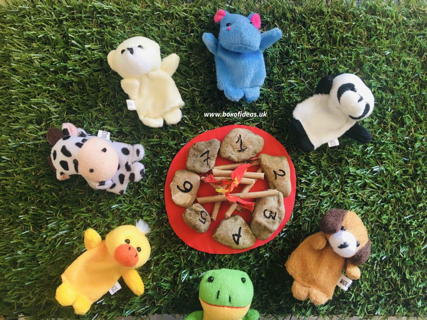 Soft animals around a campfire with numbers for Preschool