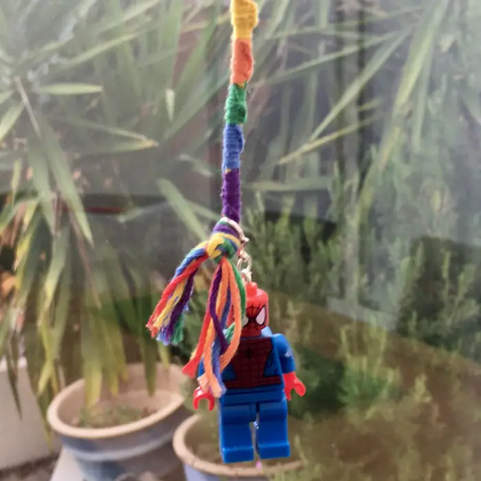 diy rainbow keychain attached to a lego spiderman charm