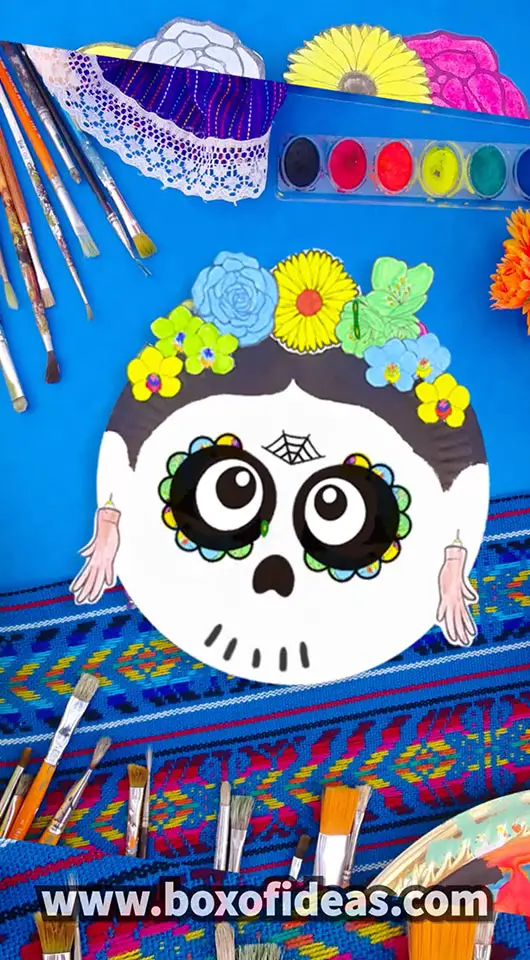 Paper Plate Frida Kahlo skull craft with colorful paper flowers