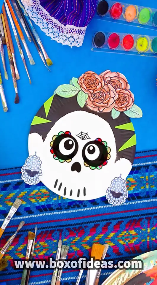 Paper Plate Frida Kahlo skull craft with peachy paper roses