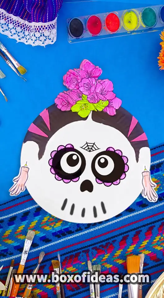 Paper Plate Frida Kahlo skull craft with pink paper flowers