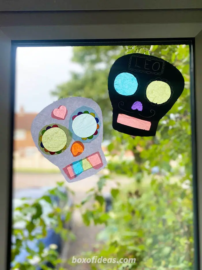 cardboard sugar skulls decoration on a classroom window